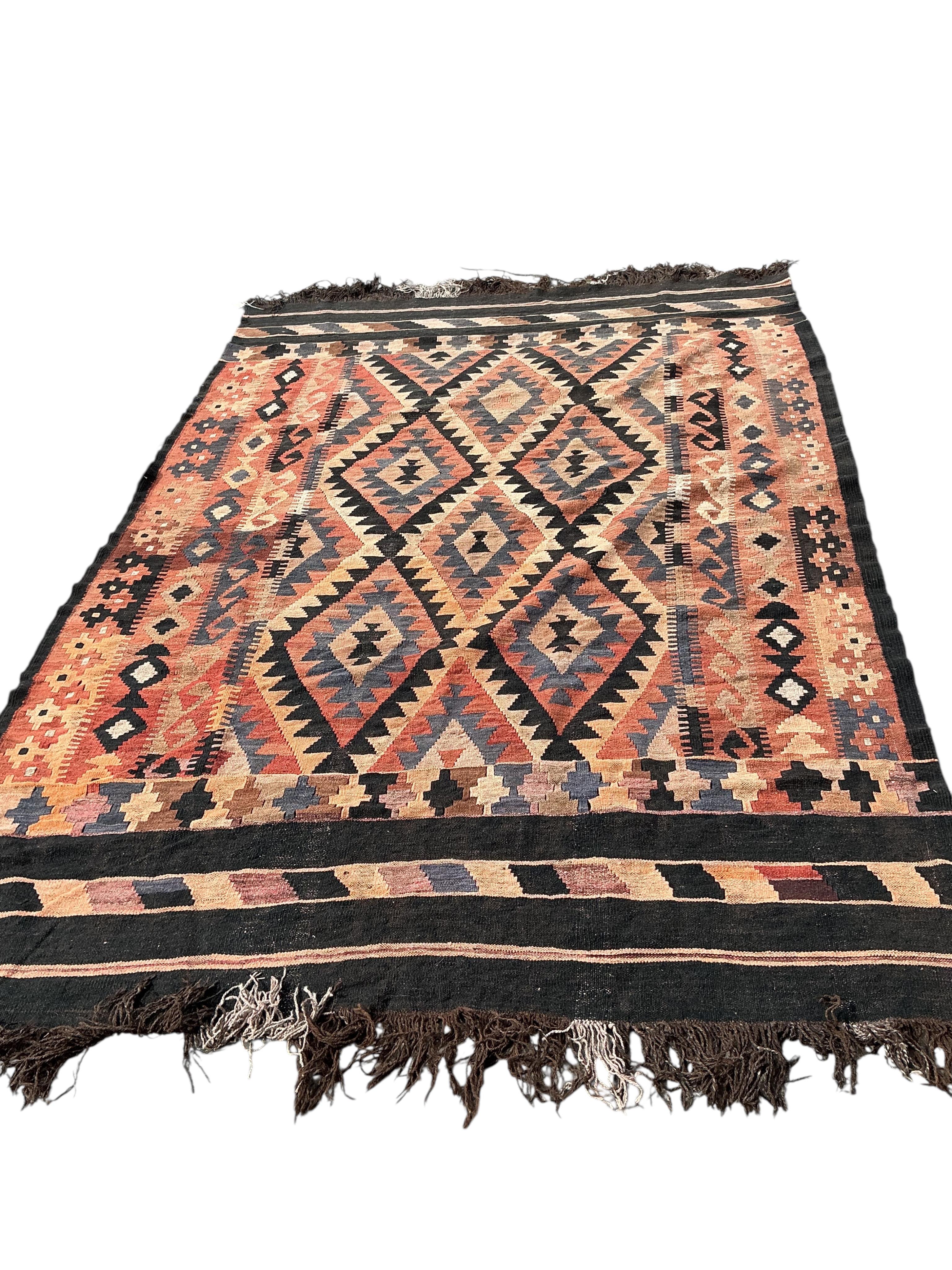 A Kilim polychrome flatweave carpet, 240 x 180cm